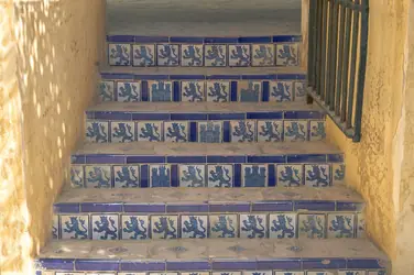 Steps faced with blue and white tiles